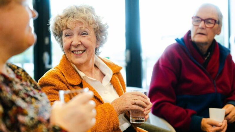 People sat having a drink while chatting