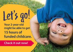 A young boy doing a headstand on grass with the words: Let's go! Your 2-year-old might be able to get 15 hours of funded childcare. Check it out now!