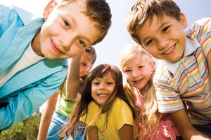 a group of young children smiling