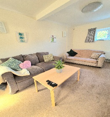 The lounge at Lyric House with two sofas and a coffee table.
