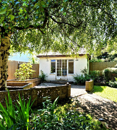A picture of the back of a house from the garden