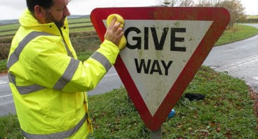 Upton Pyne self help - sign cleaning