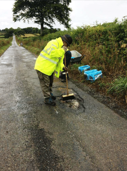 preparing a pothole for filling with the PPR