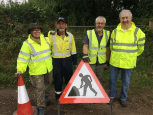 team members getting out signs before commencing work