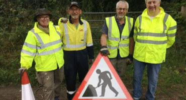 team members getting out signs before commencing work