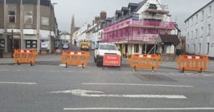 road closed sign at road in bideford with road closure barriers