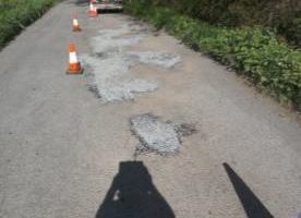 surface dressing of road at Sheepwash with traffic cones