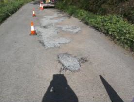 surface dressing of road at Sheepwash with traffic cones
