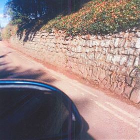 wall on side of road cleared from weeds bramble and earth