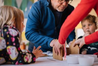 family making a gingerbread house