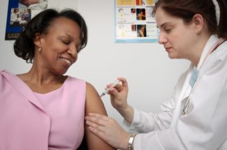 Lady getting an injection in her arm