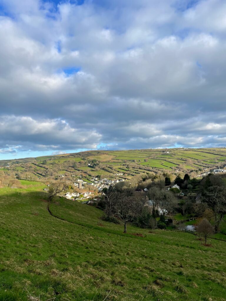 Steep sided valley with village at the bottom of the hills