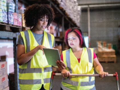 Young women working together in a warehouse