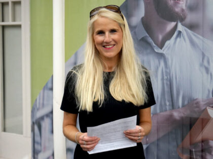 image of woman holding a piece of paper