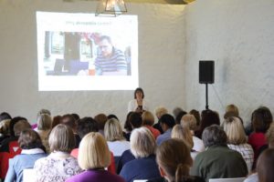 Mary Sherwood presenting slides at a Nursing conference in 2017