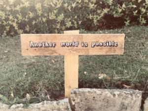 Sign in the ground which reads "Another World is possible"