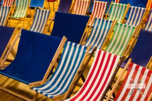 Close up of multi-coloured deck chairs