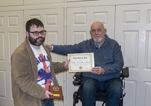 C with an award he won