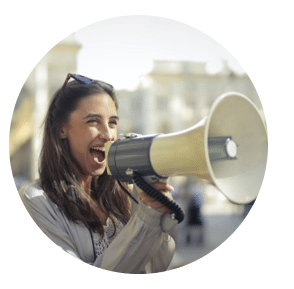 Women speaking through a loud speaker