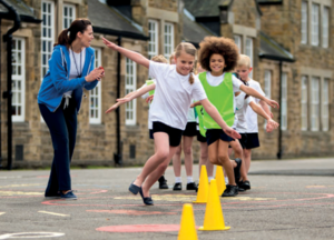 Children in playground doing excercise