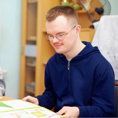 teenage boy reading a book