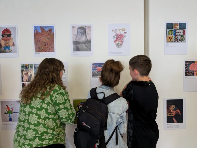 Jo Siney at art exhibition with children
