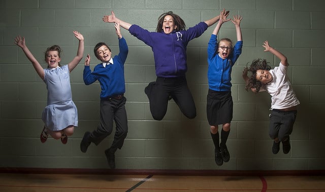 a group of children jumping in the air