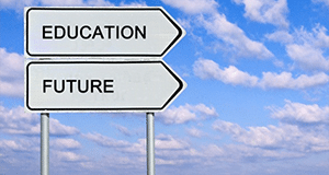 A signpost with 2 signs on against a blue sky