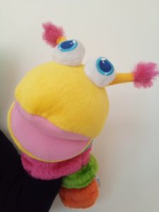 tactile soft toy caterpillar who greets children and lets them know when session has finished