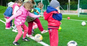 children playing football