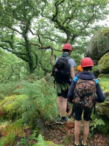 People walking through the countryside staff and children