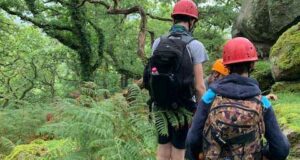 People walking through the countryside staff and children