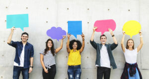 Group of young adults outdoors holding empty placard copyspace thought bubbles