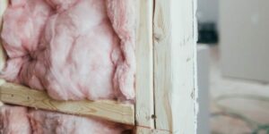 Cross section of a wall with timber frame and fibrous cavity wall insulation inside