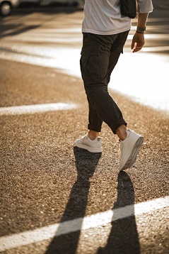 Photo by Dave Goudreau on Unsplash - person walking along road 50pc