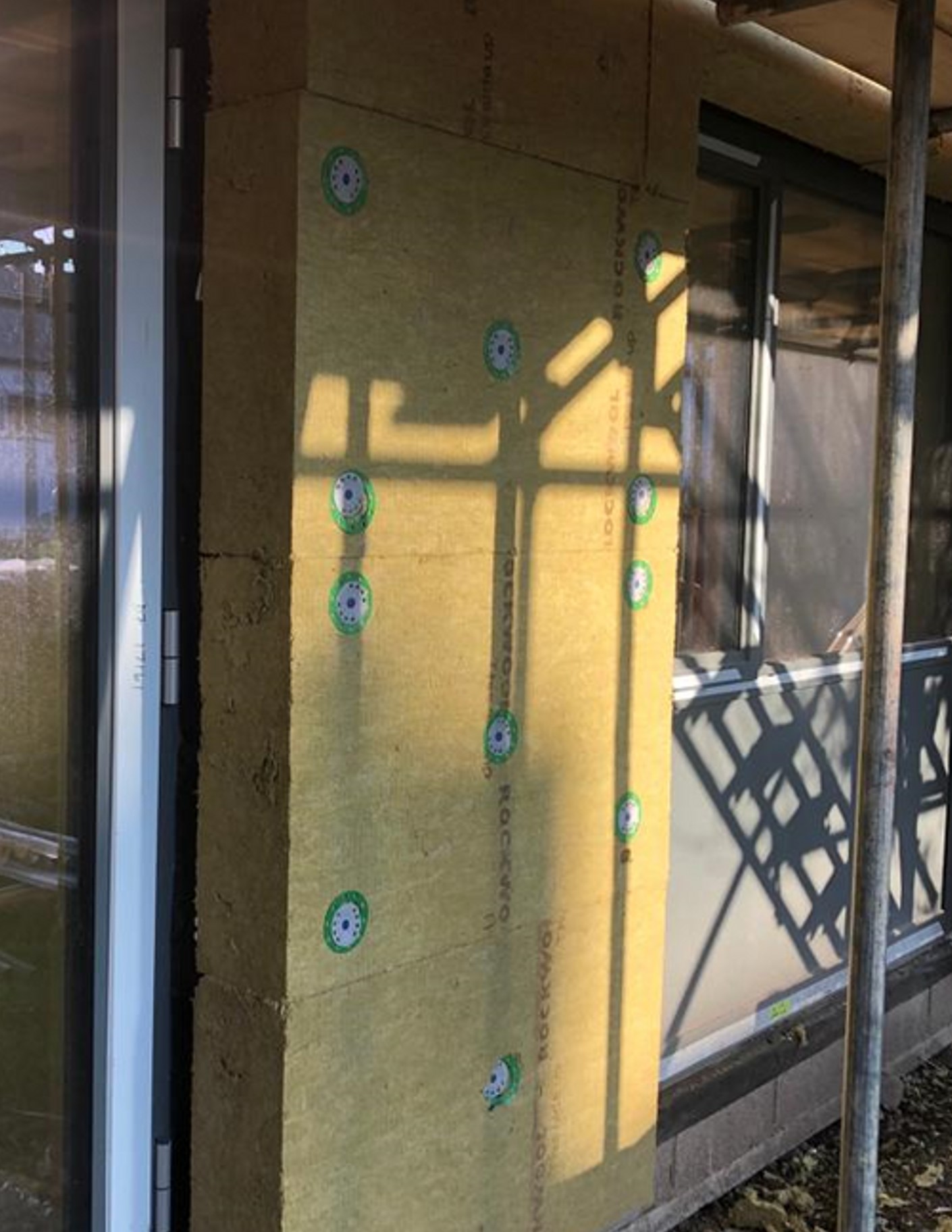 External wall insulation on a DCC building - close up