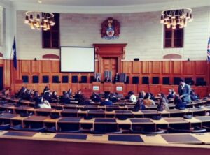 A group of people in the Council Chambers at County Hall.