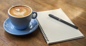 coffee cup and notepad