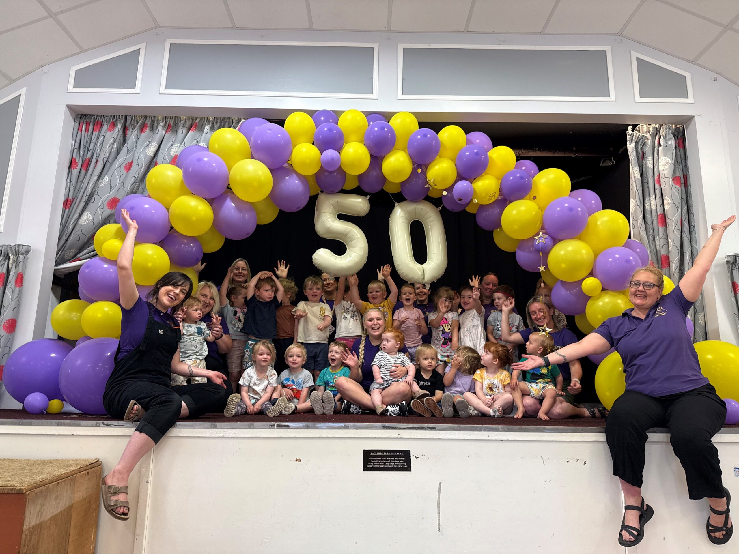 The team and children of Bow Bears pre-school celebrating the setting turning 50 this year!