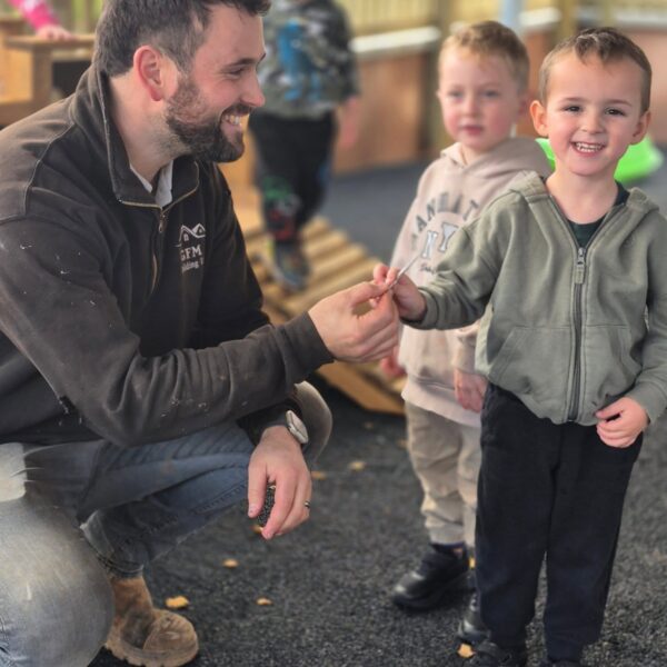 The builder hands over the keys to the new building.
