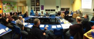 Photo showing individuals undertaking flood warden training in classroom