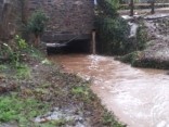 High flowing water under culvert