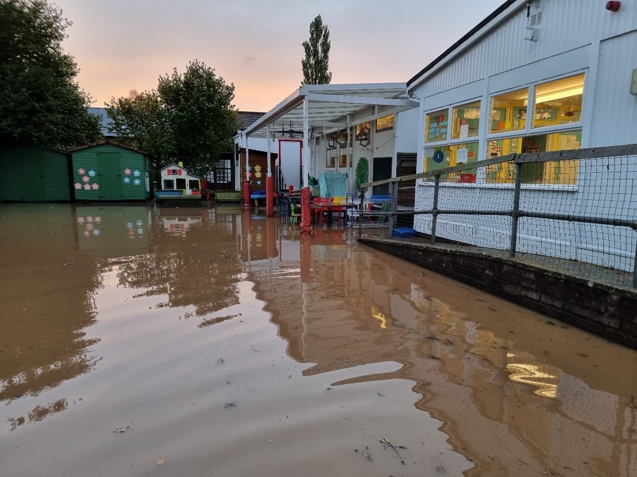 Photo of floodwaters surrounding Tipton St John School buildings following the flood incident on 20/21st October 2021.
