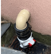 A non return valve on a pipe going into a building