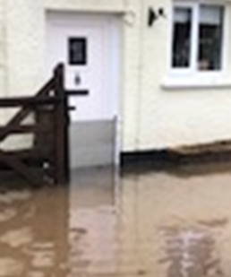 Image of property with PFR flood barrier installed on door.