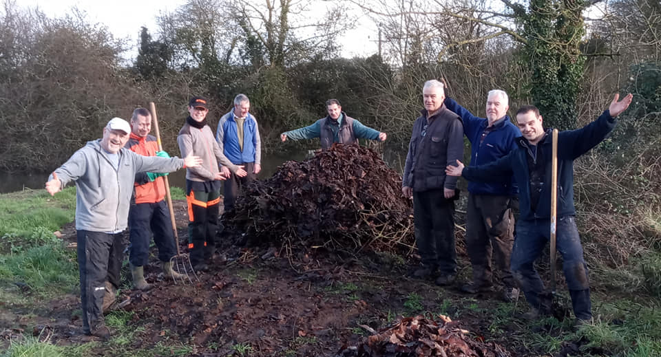 Volunteers creating a grass snake egg-laying heap at Ebear Pond.