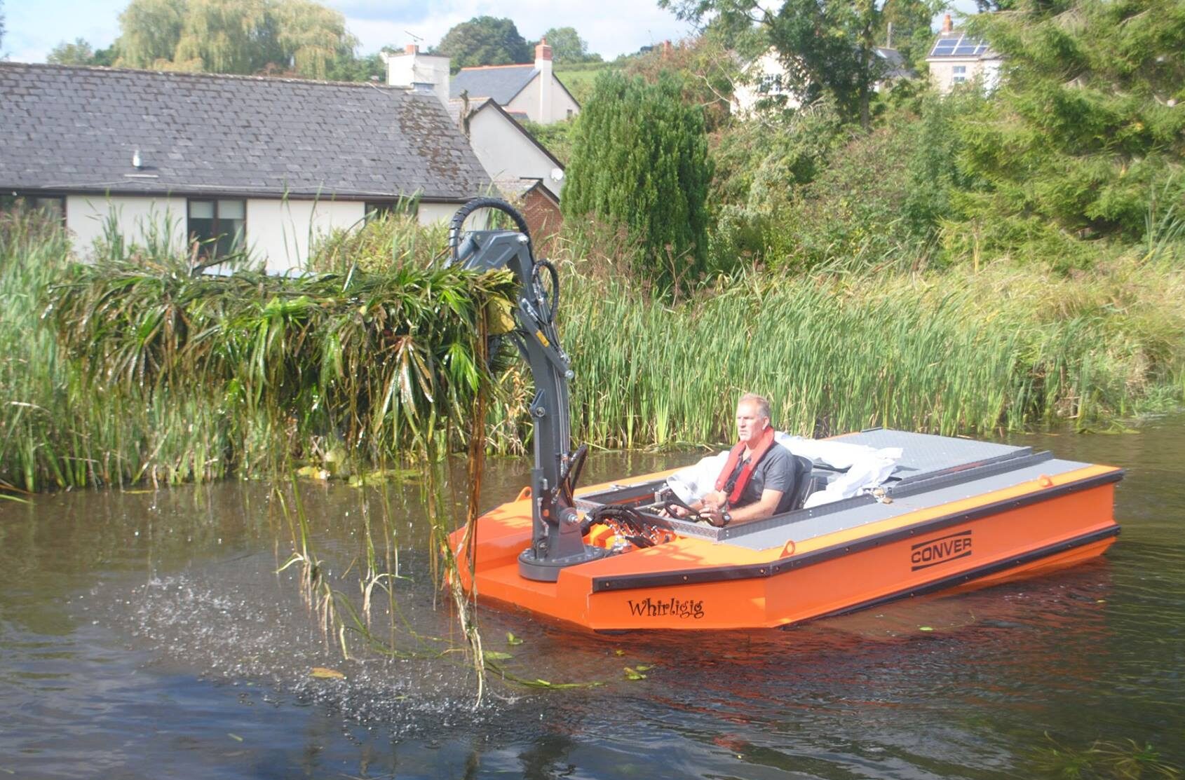 Ranger Craig clearing aquatic weed from the Canal.
