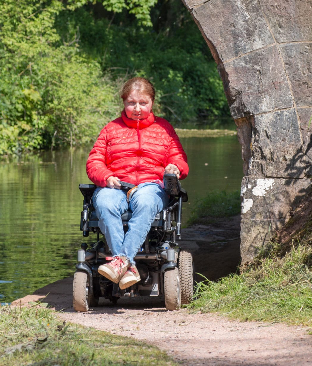 lady in wheel chair on canal path