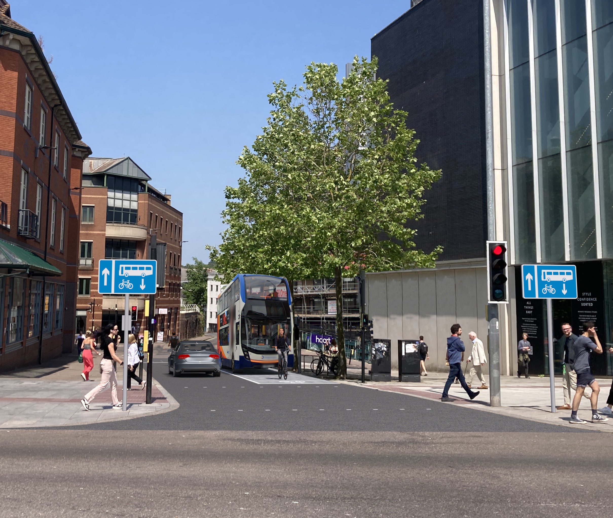 : A visualisation of the proposed New North Road bus gate and bus lane between Waterstones and John Lewis looking towards New North Road. The image shows the new contraflow bus and cycle lane signage on either side of the carriageway as well as the new road surface including the block effect imprint on the bus lane. The image shows a double decker bus and passenger car passing side by side with a cyclist in front of the bus.