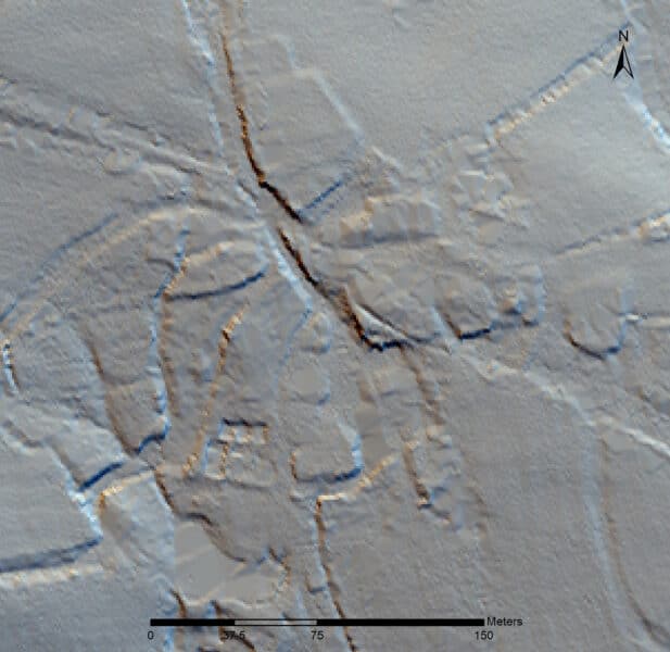Greyscale lidar imagery showing raised areas either side of incised roadways.